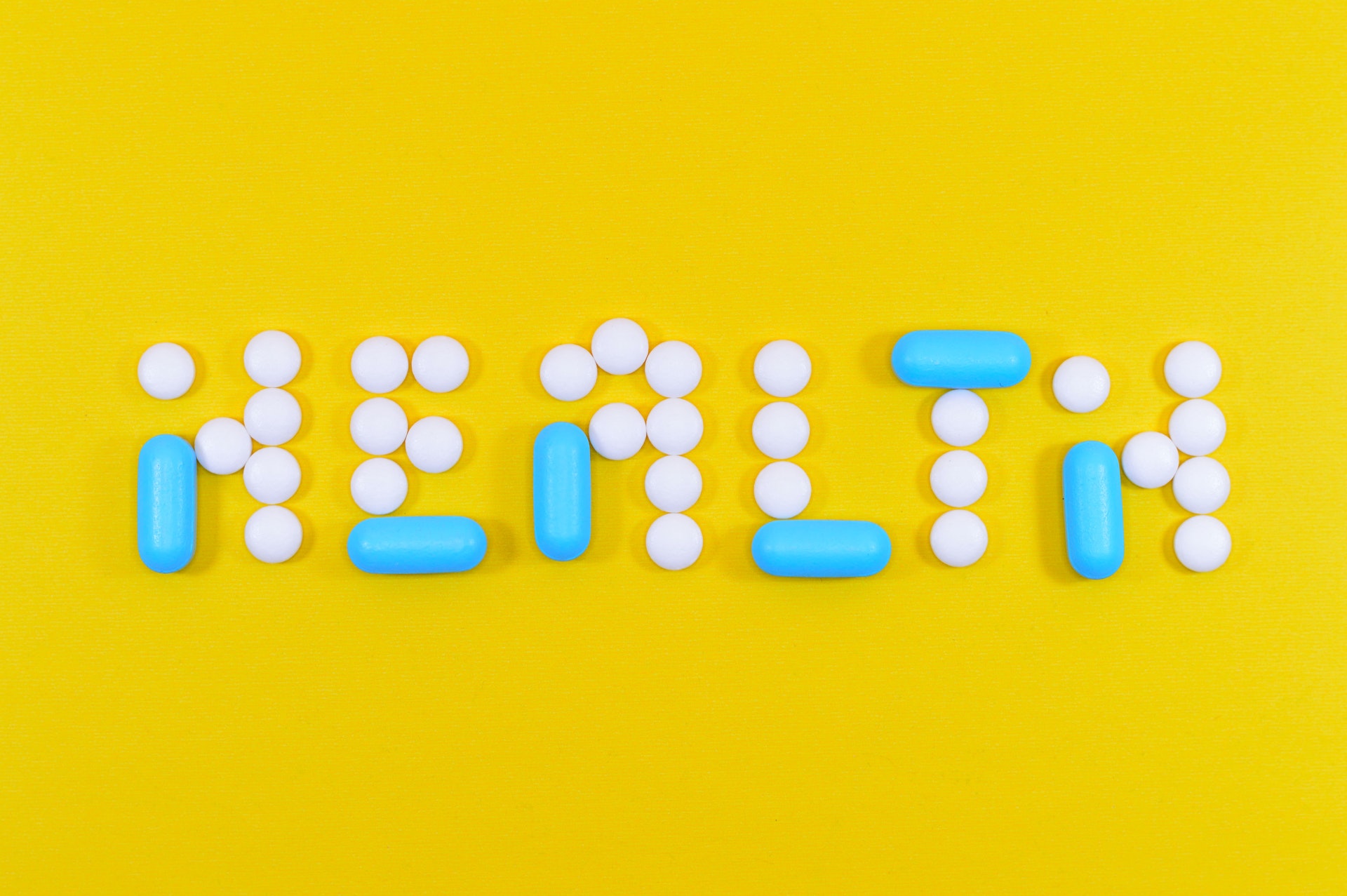 white-and-blue-health-pill-and-tablet-letter